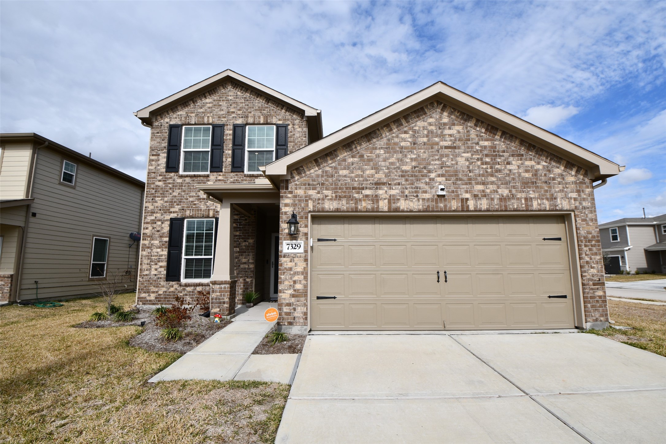 7329 Madison Commons Lane Houston, TX 77075 - Photo 2 of 22 a view of a house with a yard