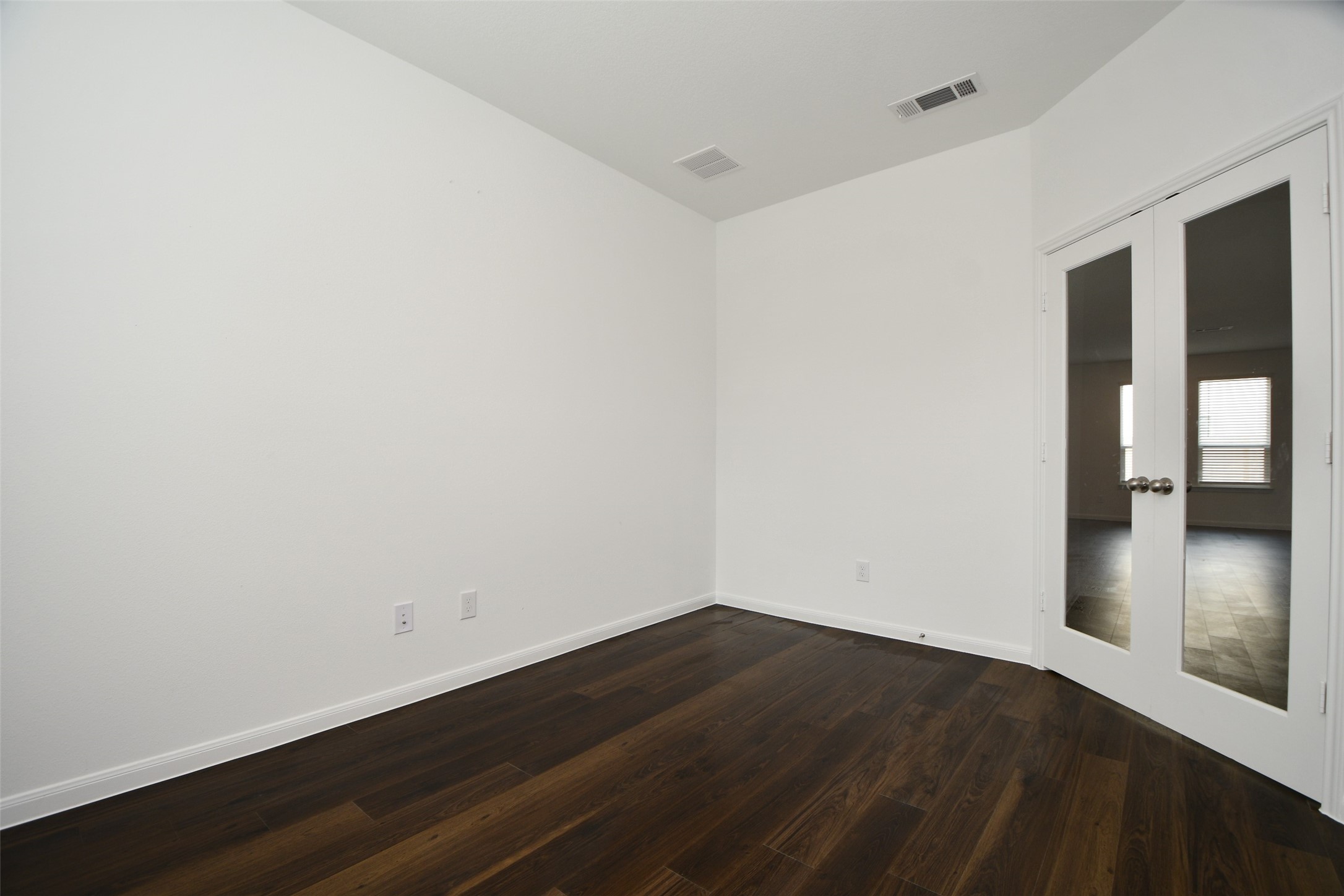 7329 Madison Commons Lane Houston, TX 77075 - Photo 6 of 22 wooden floor in an empty room