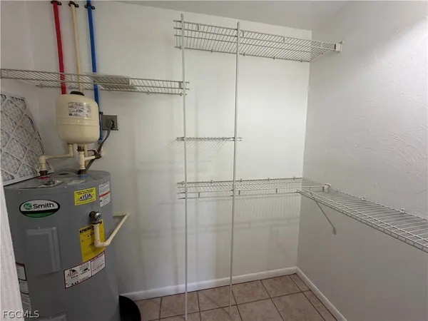 a view of storage and utility room with racks on the wall