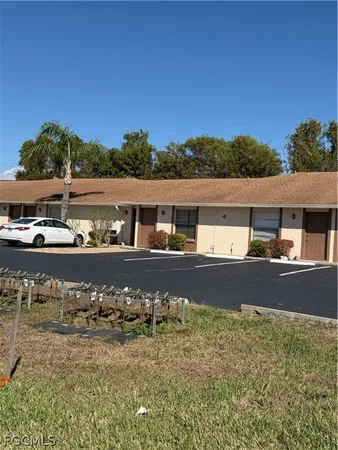 a view of house with outdoor space and swimming pool