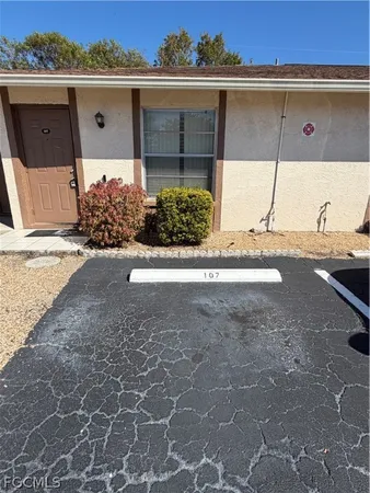 a view of a house with a street