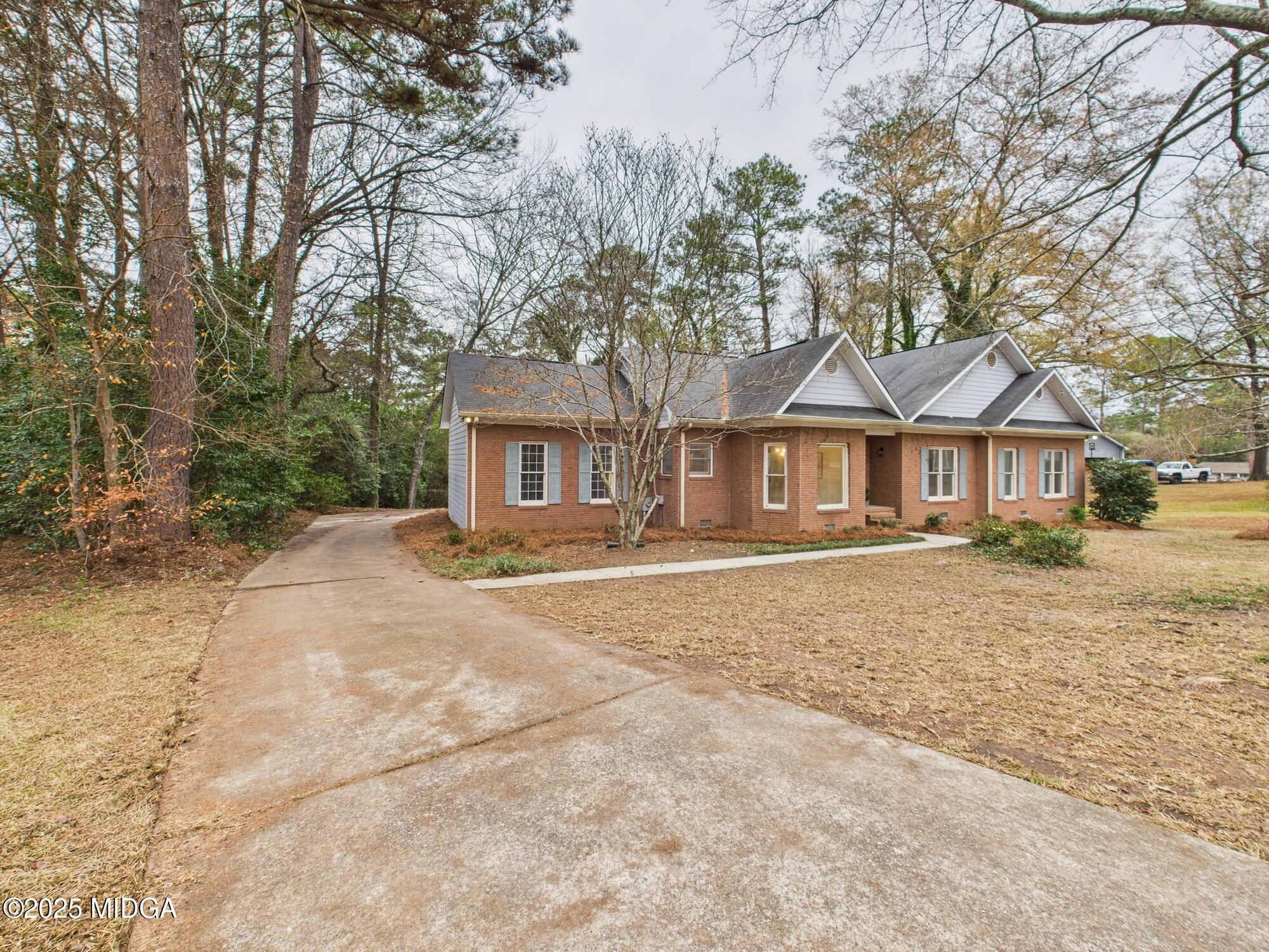 607 Chastain Place Macon, GA 31210 - Photo 2 of 63 a front view of a house with a yard and garage