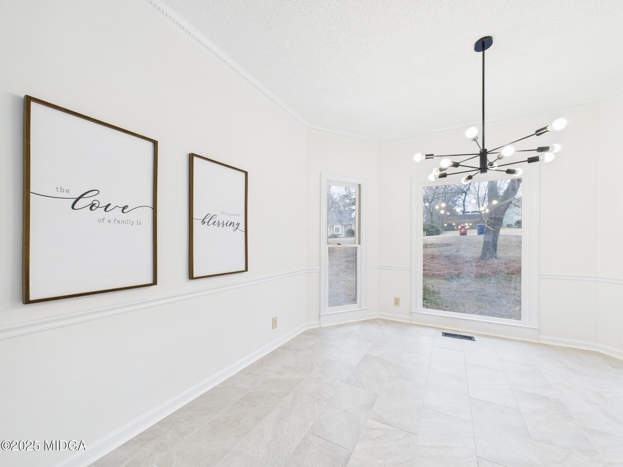 607 Chastain Place Macon, GA 31210 - Photo 21 of 63 a view of a room with window and chandelier