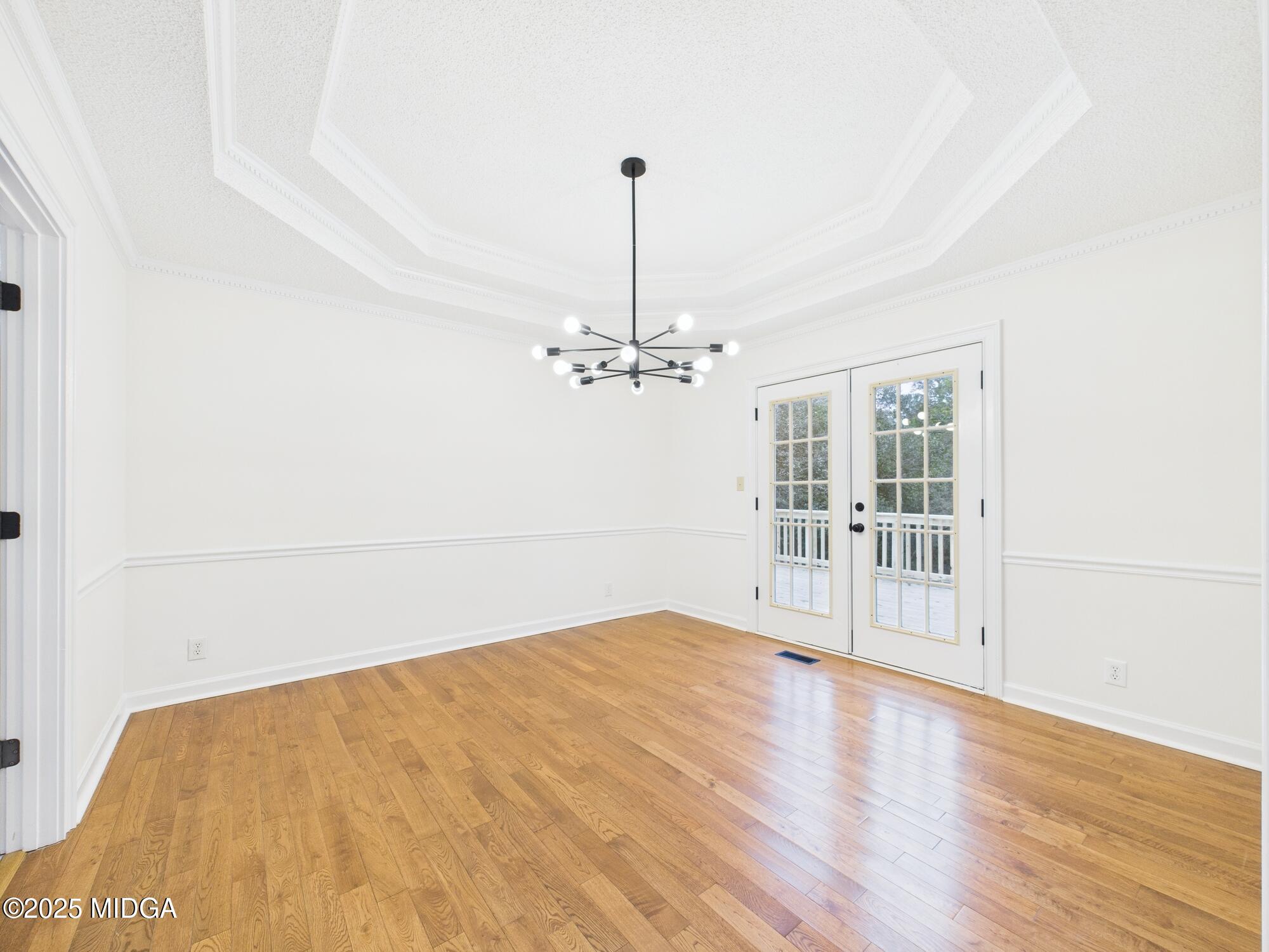 607 Chastain Place Macon, GA 31210 - Photo 22 of 63 a view of empty room with wooden floor and fan