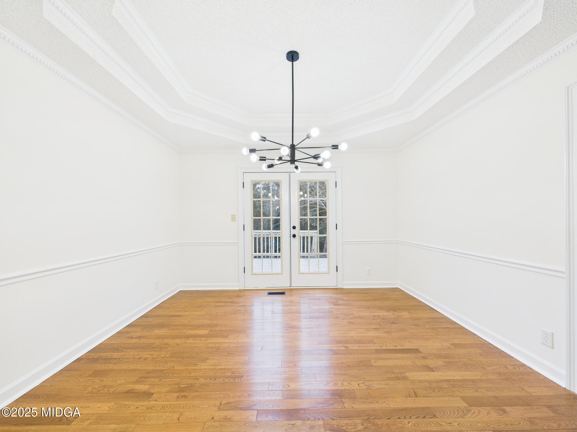 607 Chastain Place Macon, GA 31210 - Photo 24 of 63 a view of a room with wooden floor ceiling fan and window