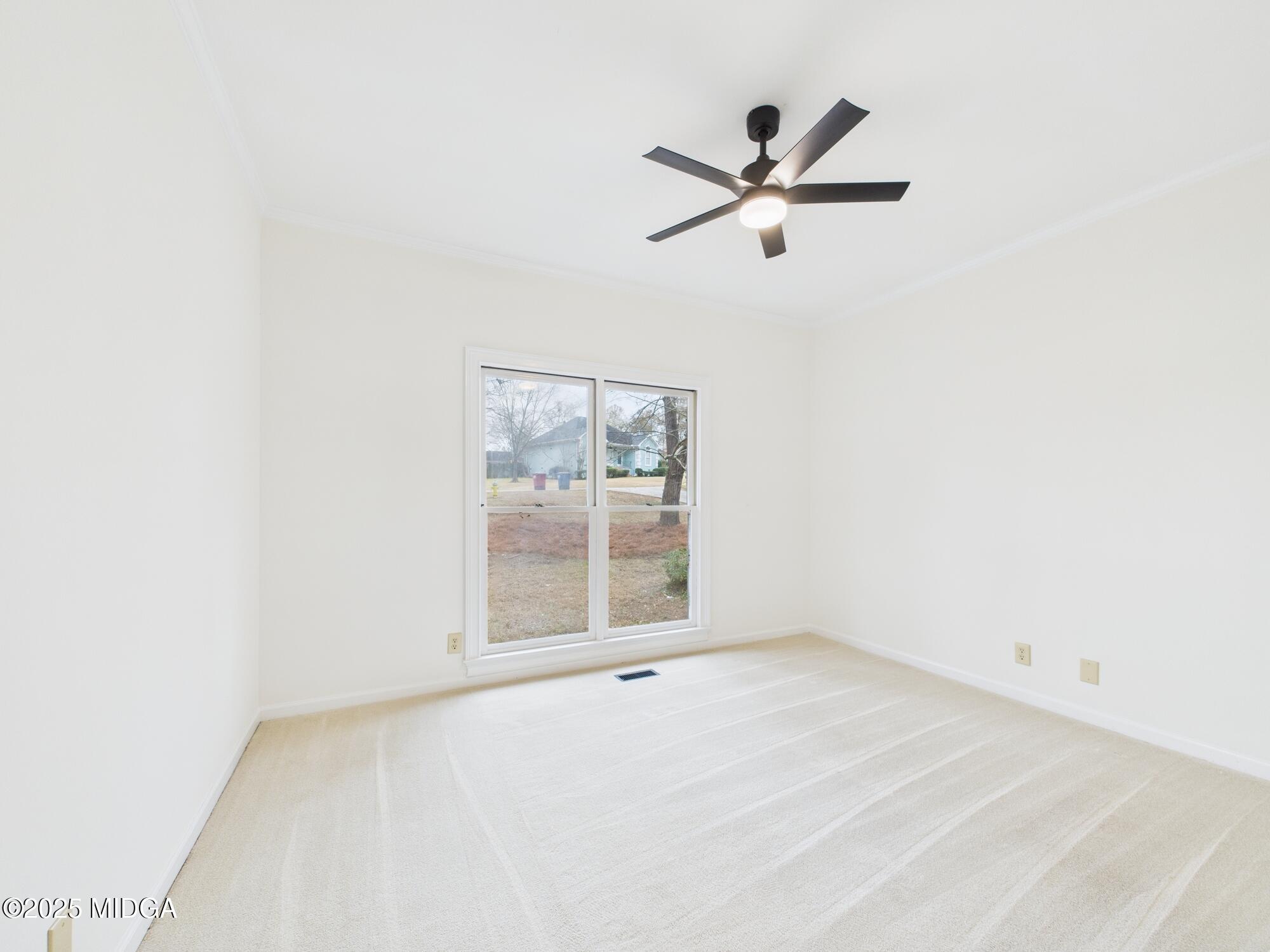 607 Chastain Place Macon, GA 31210 - Photo 32 of 63 an empty room with window and ceiling fan