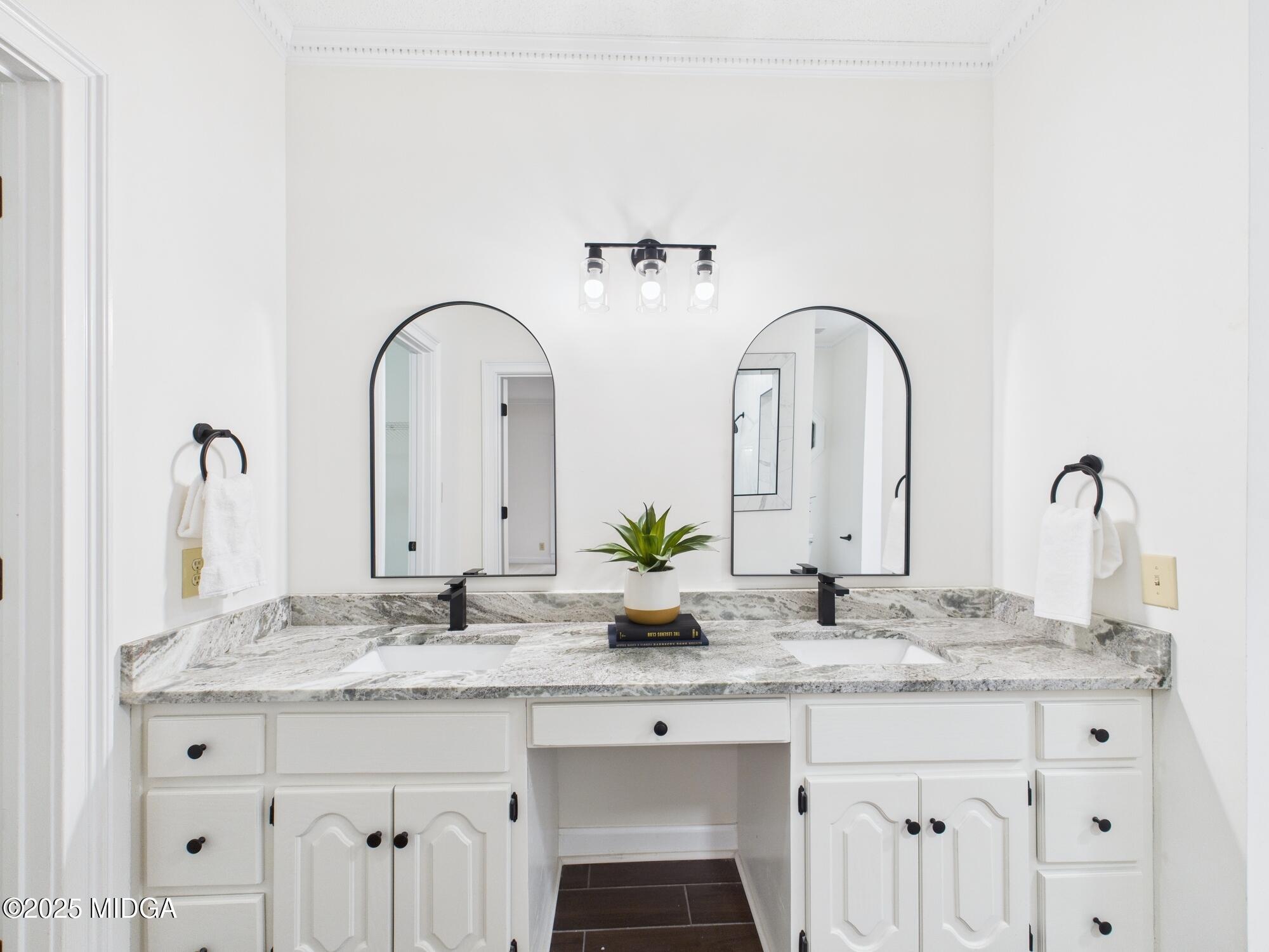 607 Chastain Place Macon, GA 31210 - Photo 41 of 63 a bathroom with double sink and a mirror