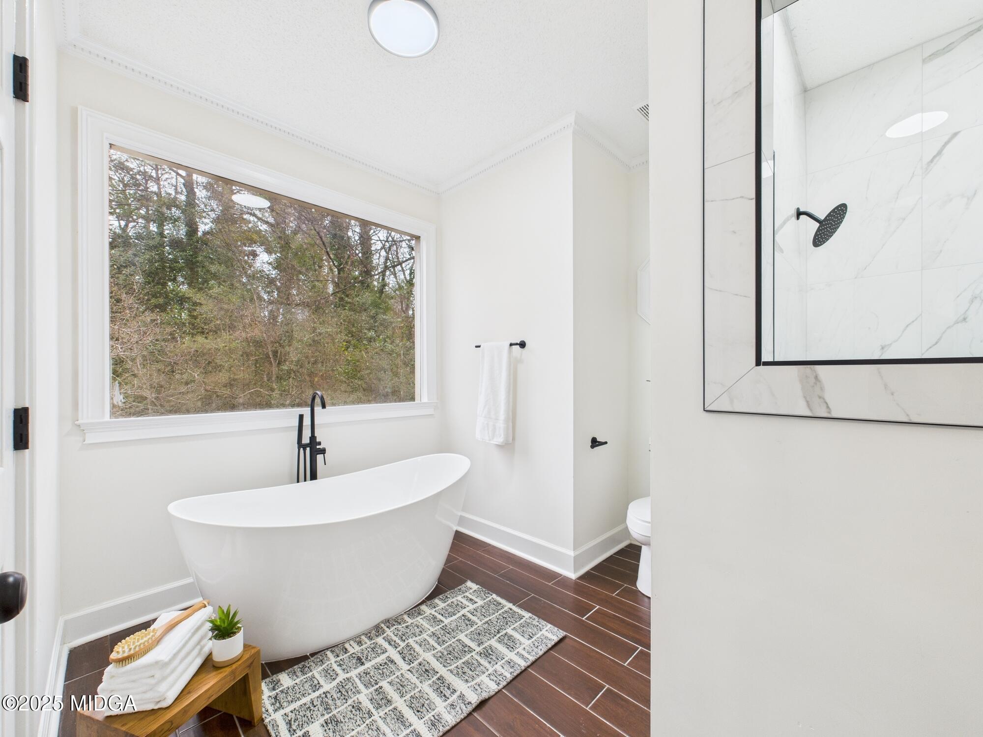 607 Chastain Place Macon, GA 31210 - Photo 42 of 63 a white bath tub sitting next to a window
