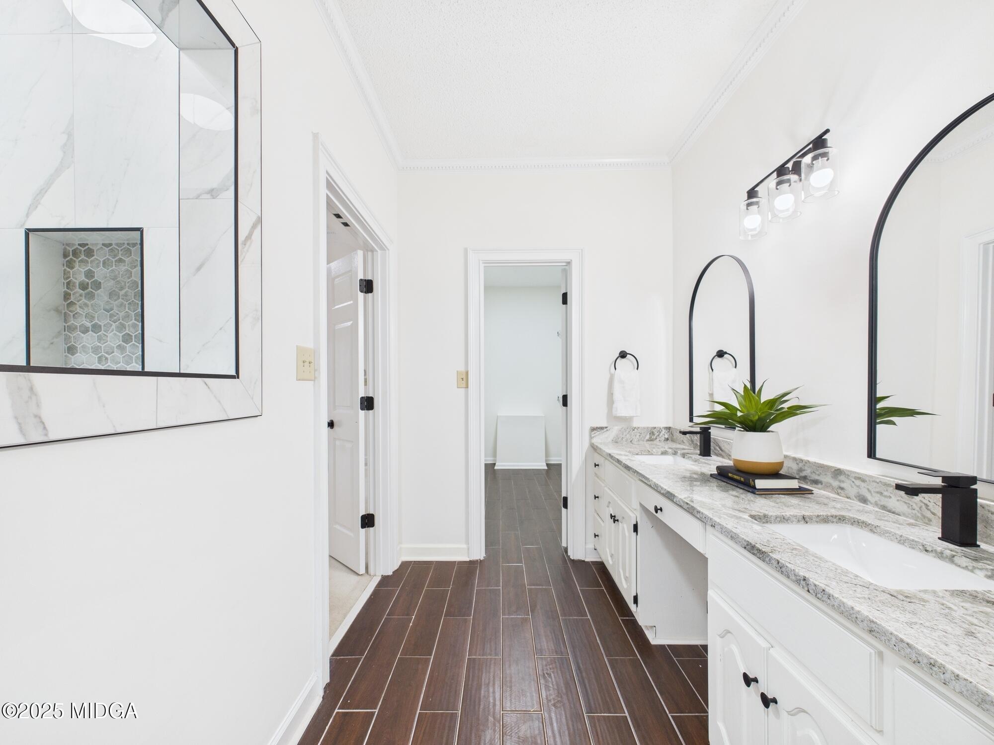 607 Chastain Place Macon, GA 31210 - Photo 46 of 63 a bathroom with a granite countertop sink a mirror and a shower
