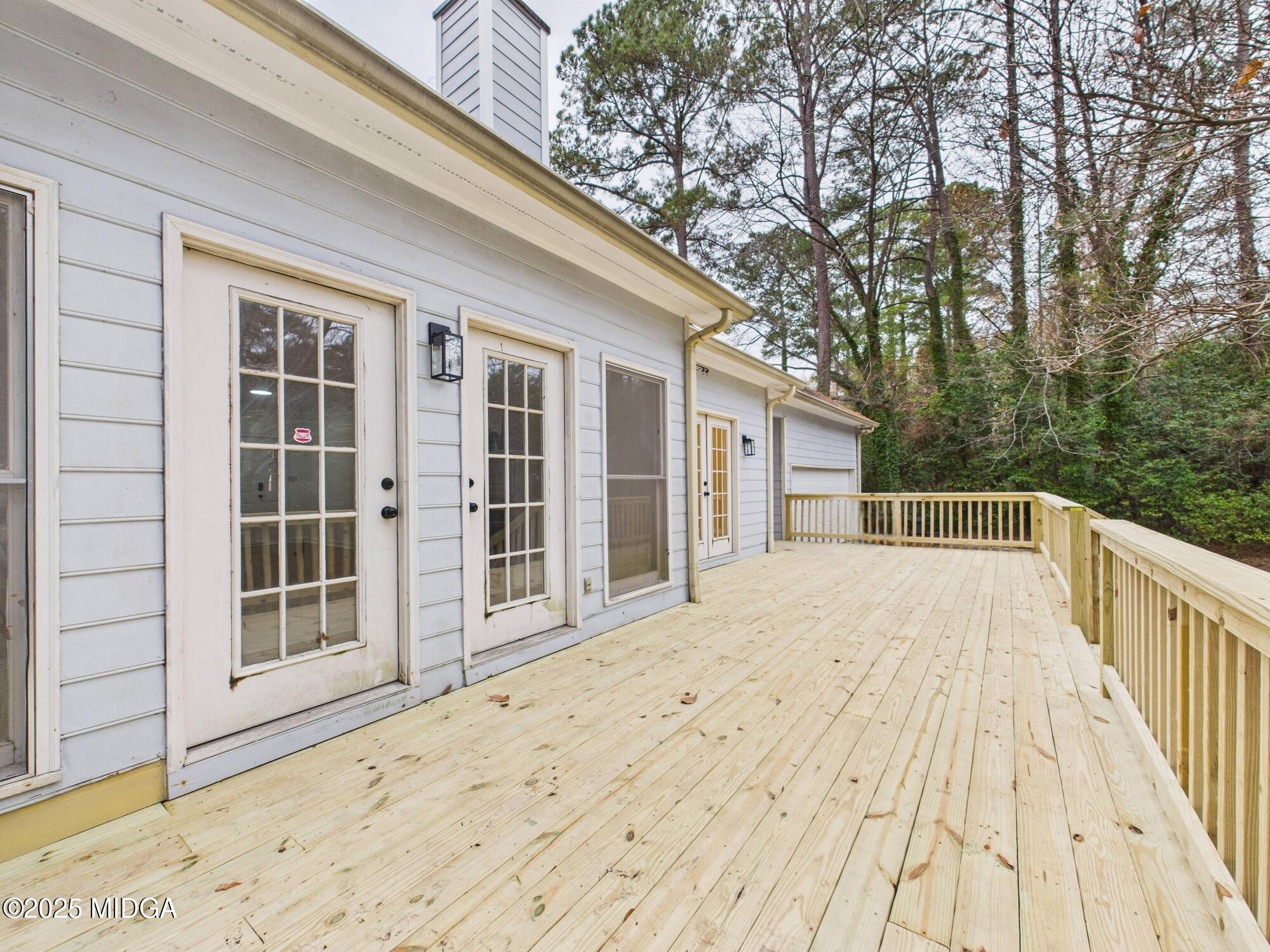 607 Chastain Place Macon, GA 31210 - Photo 53 of 63 a view of backyard with large trees and wooden fence