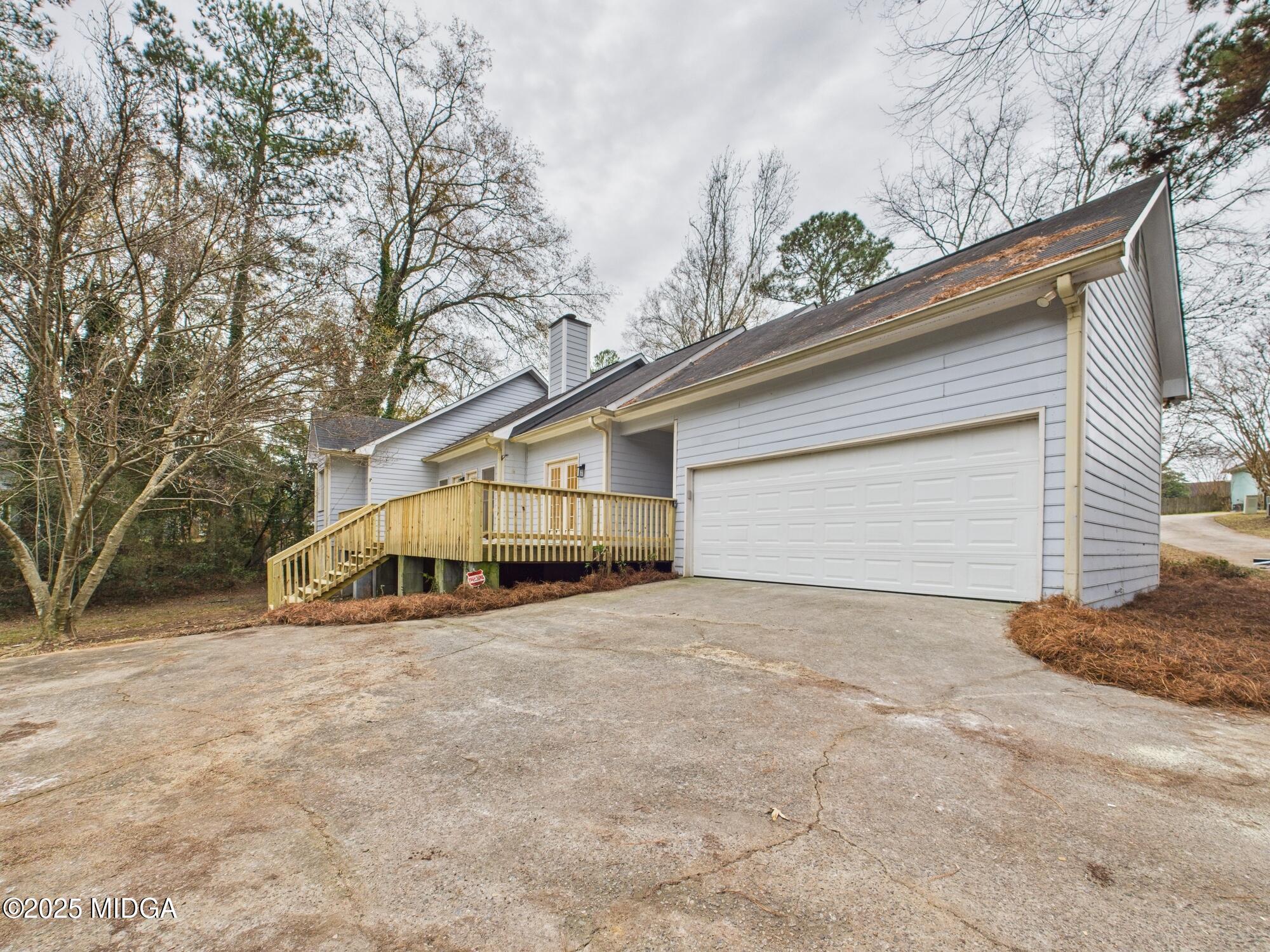 607 Chastain Place Macon, GA 31210 - Photo 56 of 63 a view of a house with a yard and garage