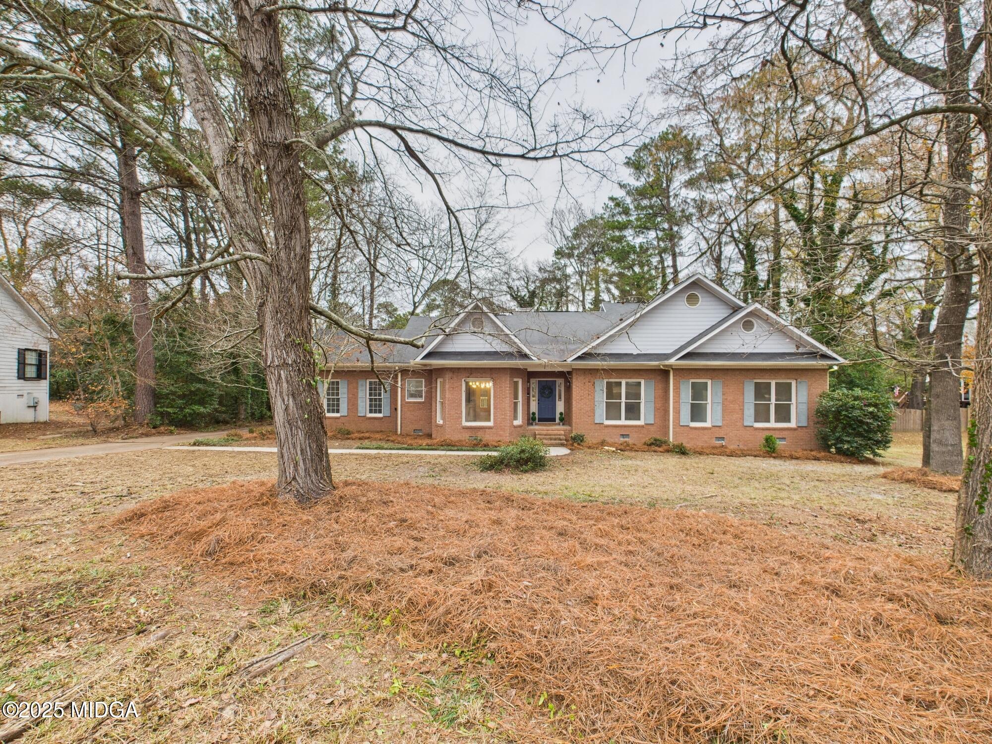 607 Chastain Place Macon, GA 31210 - Photo 61 of 63 a front of a house with a yard and large trees