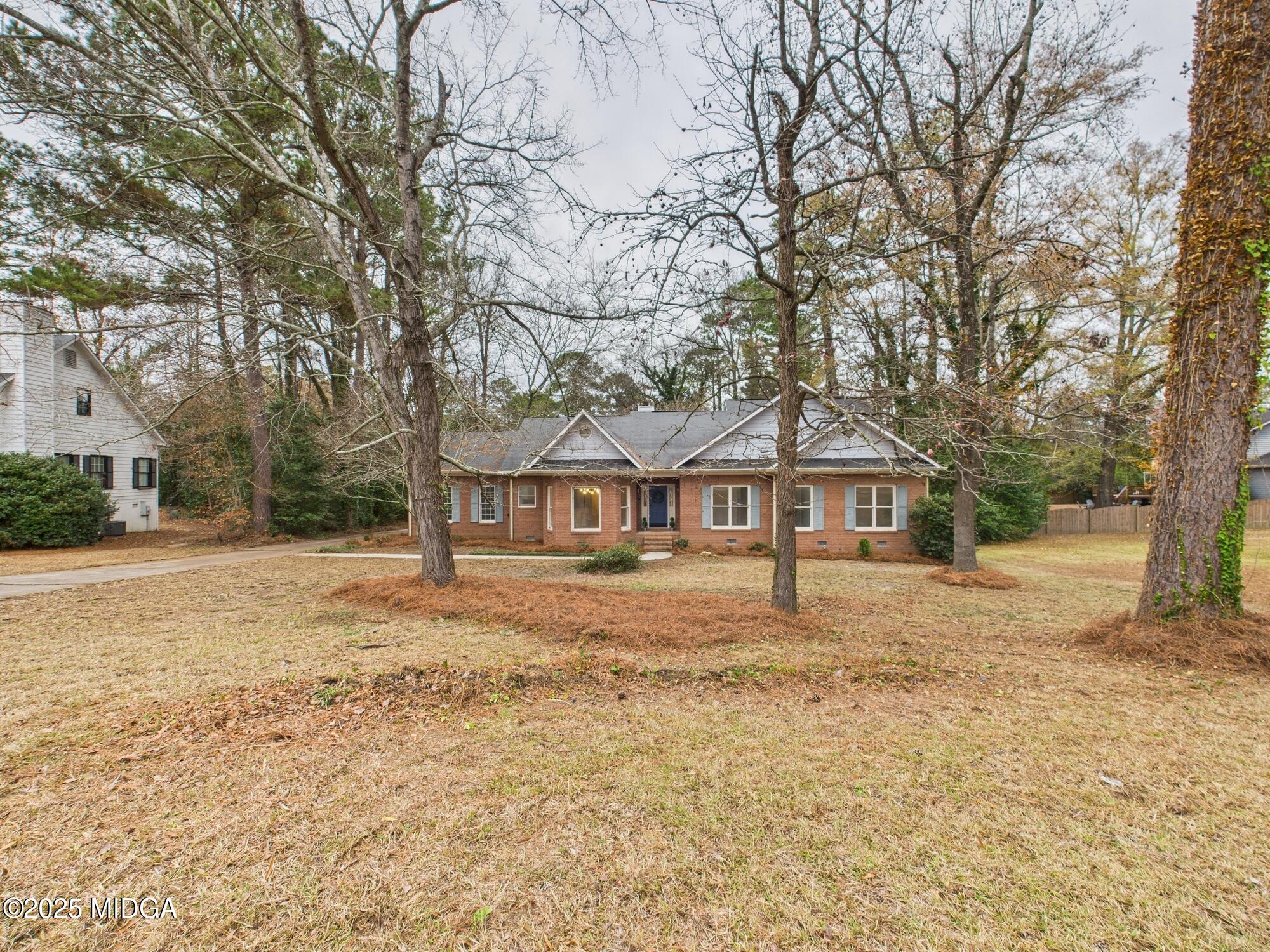 607 Chastain Place Macon, GA 31210 - Photo 63 of 63 a white house that has a tree in front of it