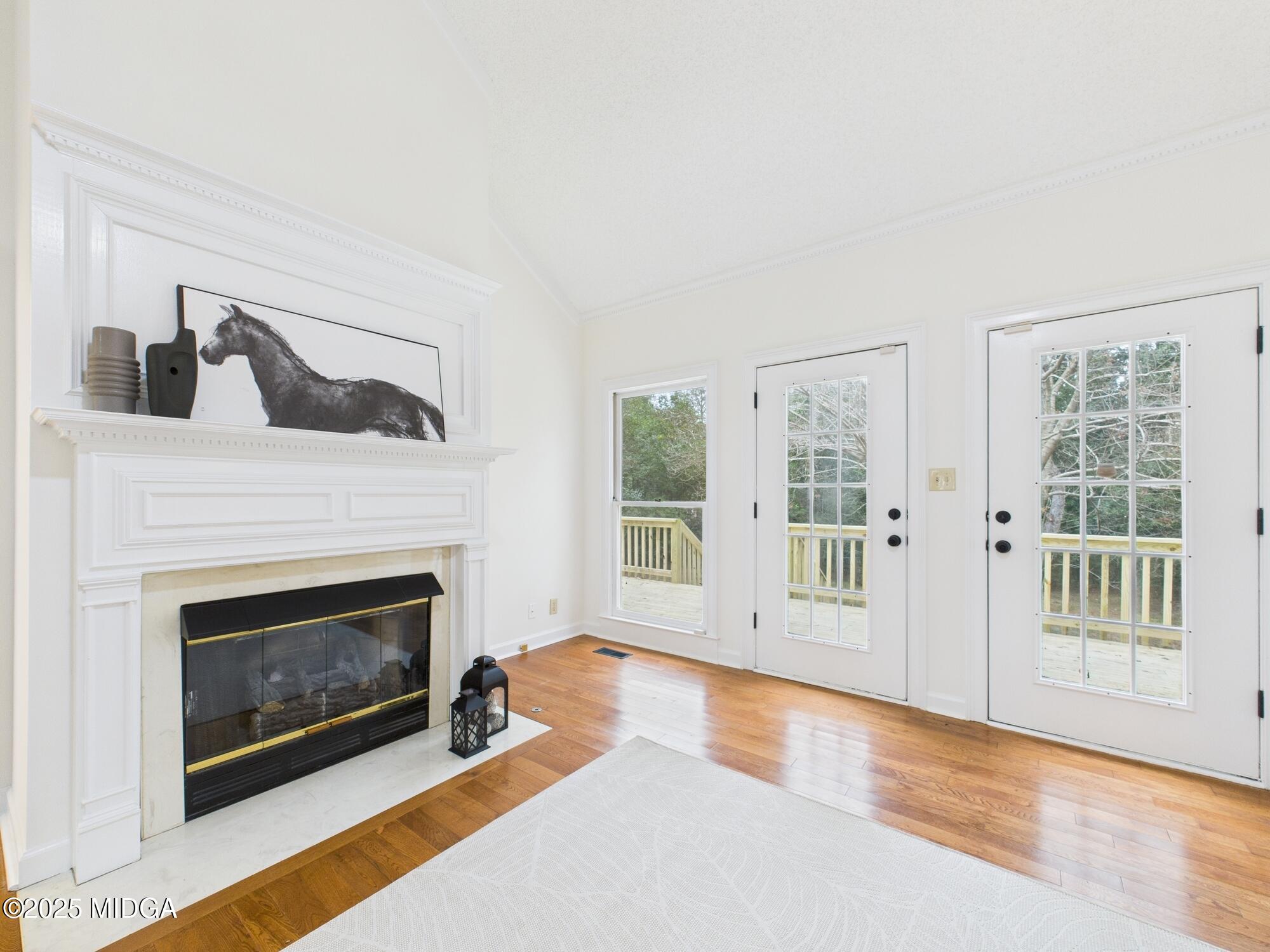 607 Chastain Place Macon, GA 31210 - Photo 9 of 63 a living room with furniture and a fireplace