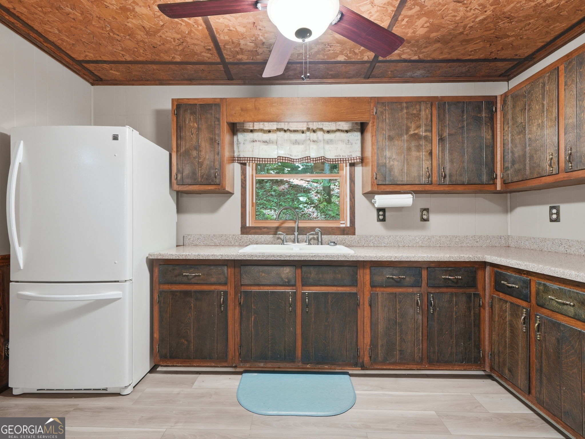 629 Goose Island Road Cherry Log, GA 30522 - Photo 10 of 52 a kitchen with a refrigerator and a sink