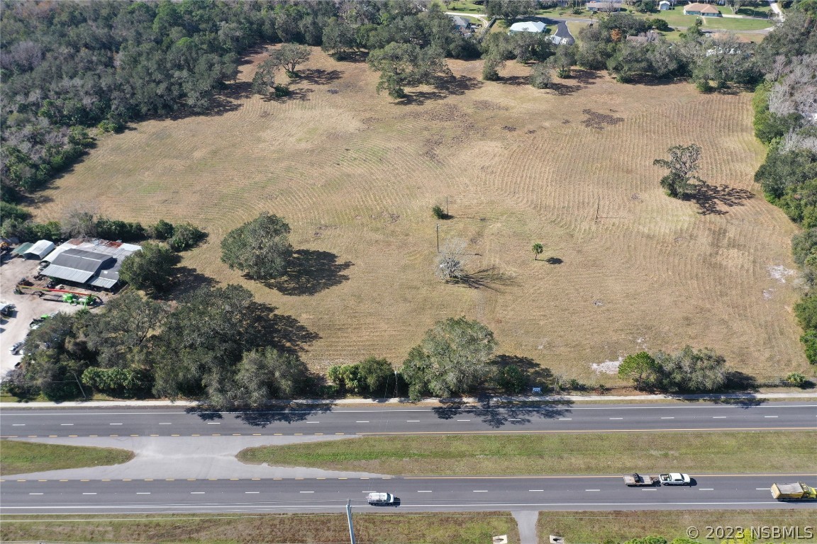 4558 South Ridgewood Avenue Edgewater, FL 32141 - Photo 8 of 9 an aerial view of a houses with yard