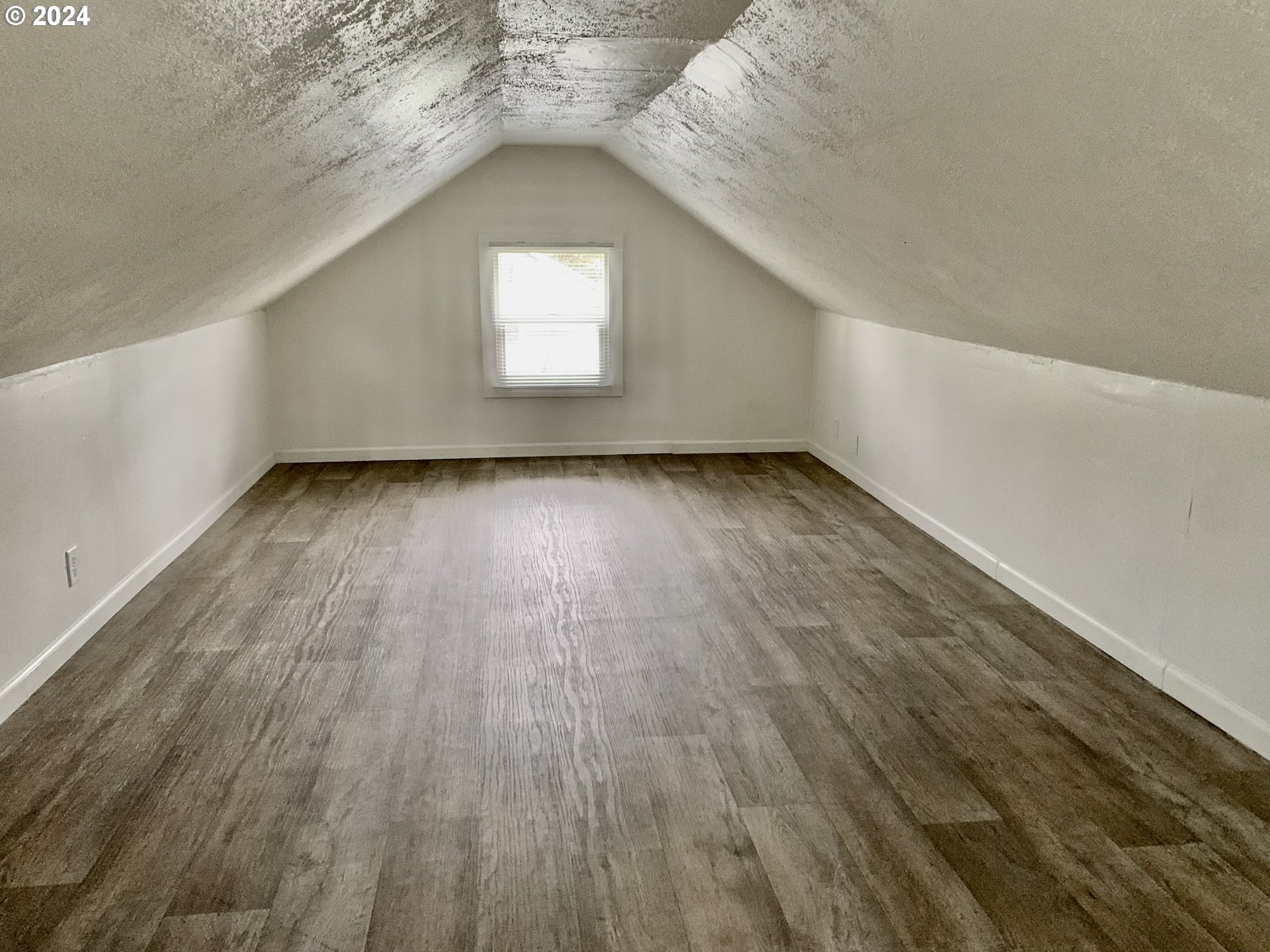 630 1st Street Springfield, OR 97477 - Photo 13 of 18 a view of a room with wooden floor and window
