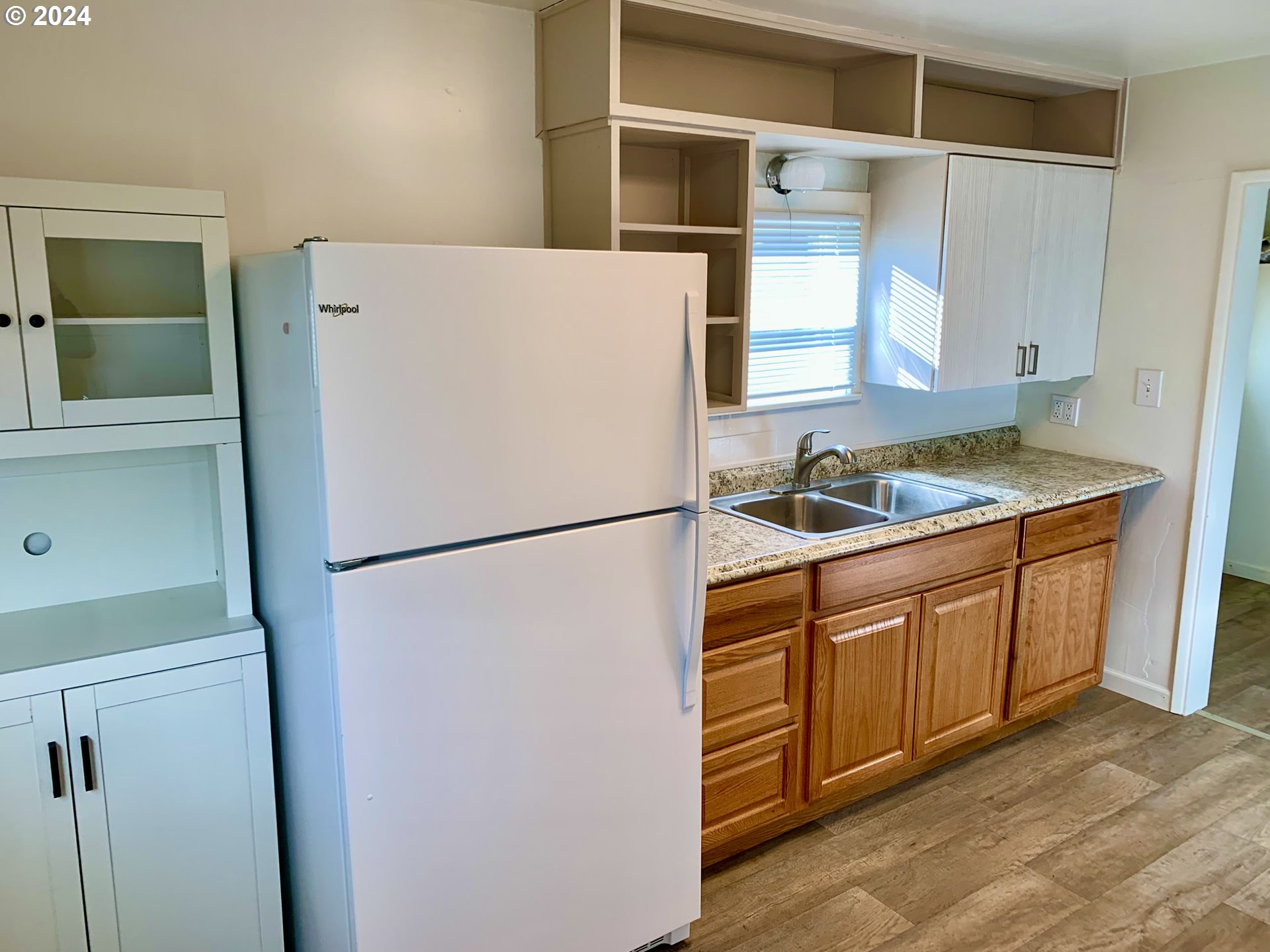 630 1st Street Springfield, OR 97477 - Photo 5 of 18 a white refrigerator freezer sitting inside of a kitchen