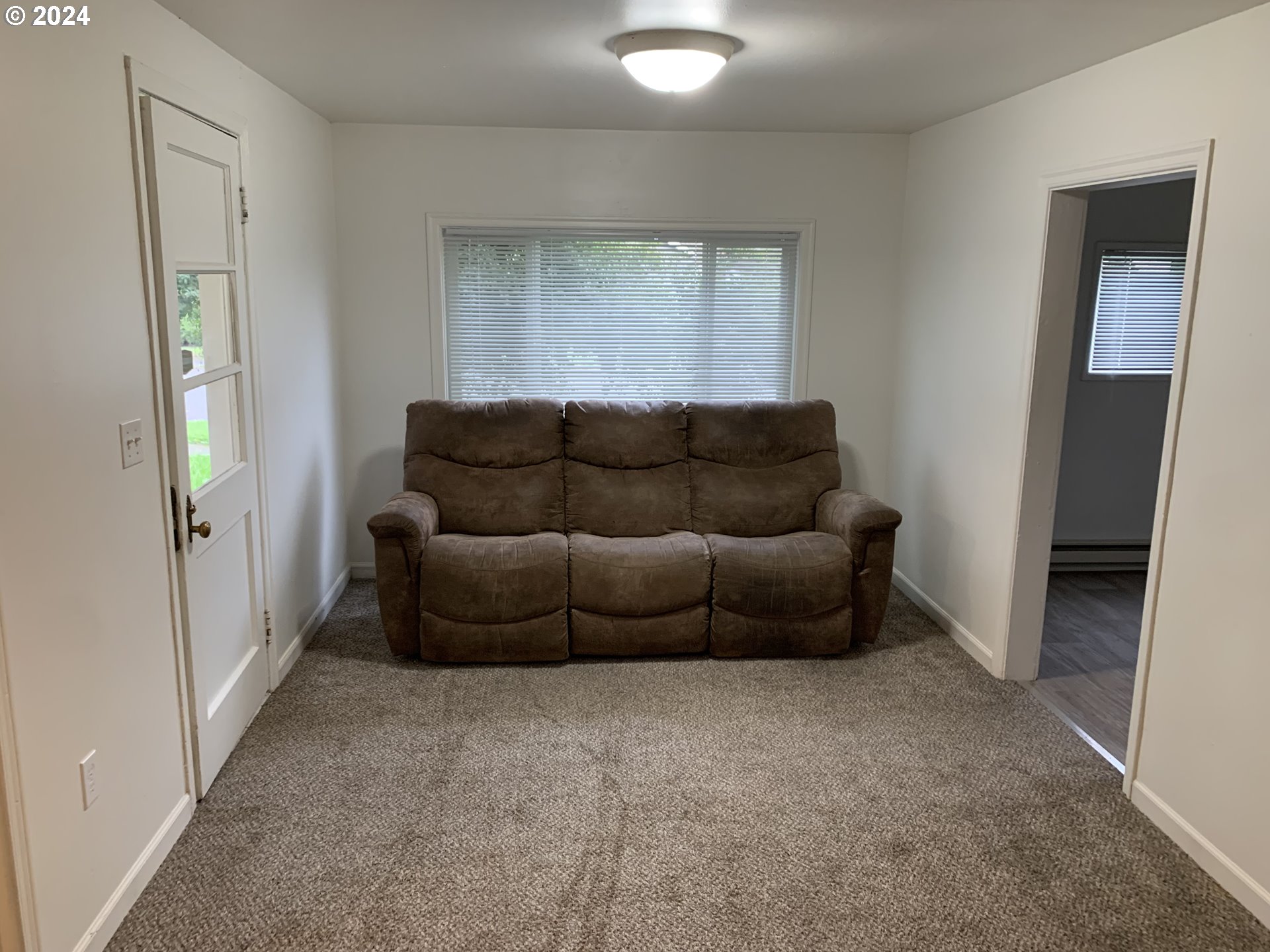 630 1st Street Springfield, OR 97477 - Photo 8 of 18 a living room with furniture and a window