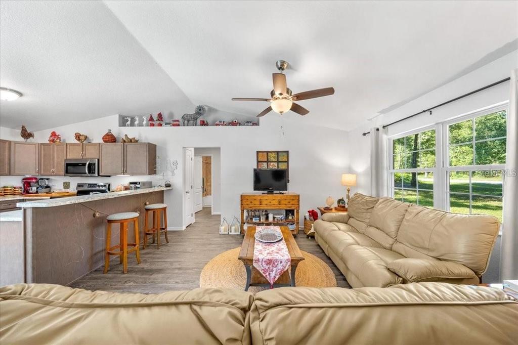 543 North Rooks Avenue Inverness, FL 34453 - Photo 6 of 14 a living room with furniture and a large window