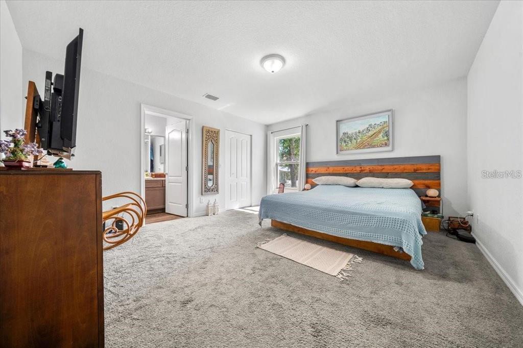 543 North Rooks Avenue Inverness, FL 34453 - Photo 8 of 14 a bedroom with a bed and a flat screen tv