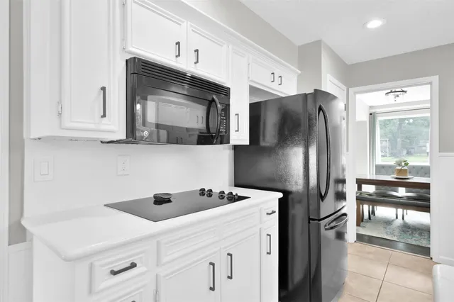 a kitchen with stainless steel appliances a refrigerator sink and cabinets