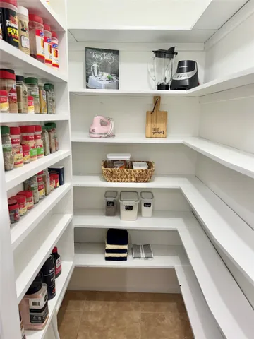 a room with furniture a book shelf and a book shelf