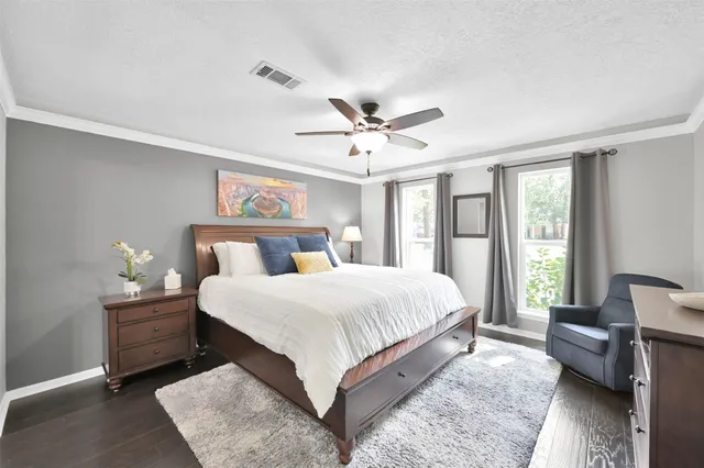 a bedroom with a large bed and a couch