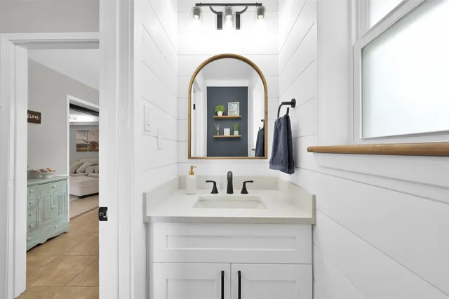 a bathroom with a sink and a mirror