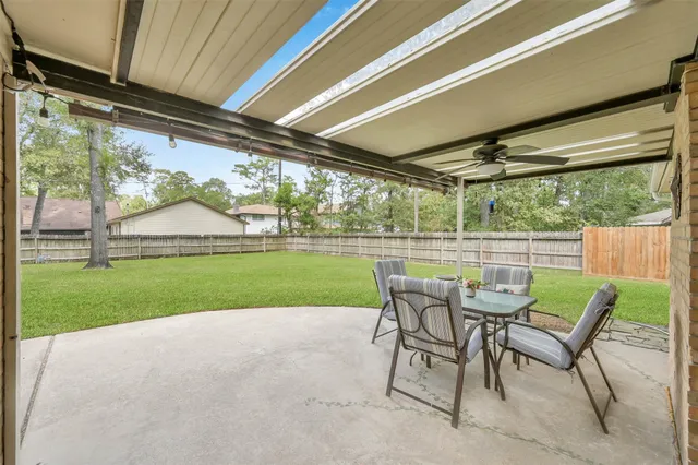 a view of a porch with furniture and yard