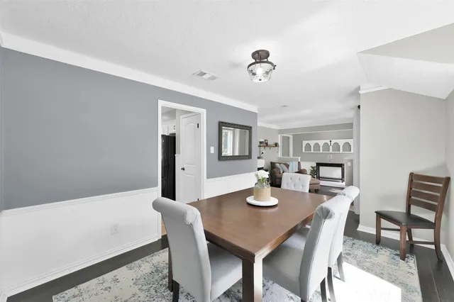 a view of a dining room with furniture