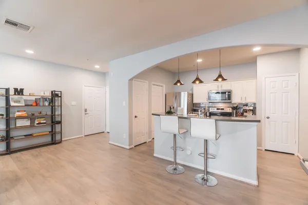 a view of kitchen and wooden floor