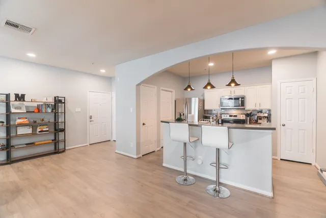 a view of kitchen and wooden floor