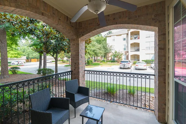 a view of a chair and table in the balcony