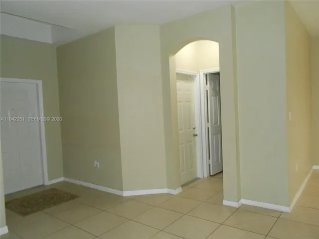 a view of a bathroom with mirror
