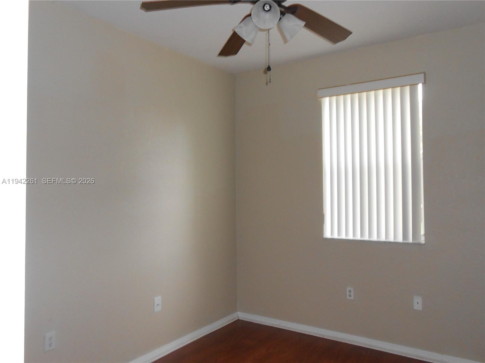 12470 Southwest 122nd Street Miami, FL 33186 - Photo 18 of 26 an empty room with a window