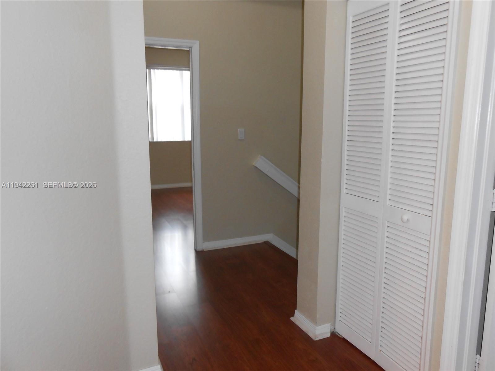 12470 Southwest 122nd Street Miami, FL 33186 - Photo 20 of 26 a view of a hallway with wooden floor