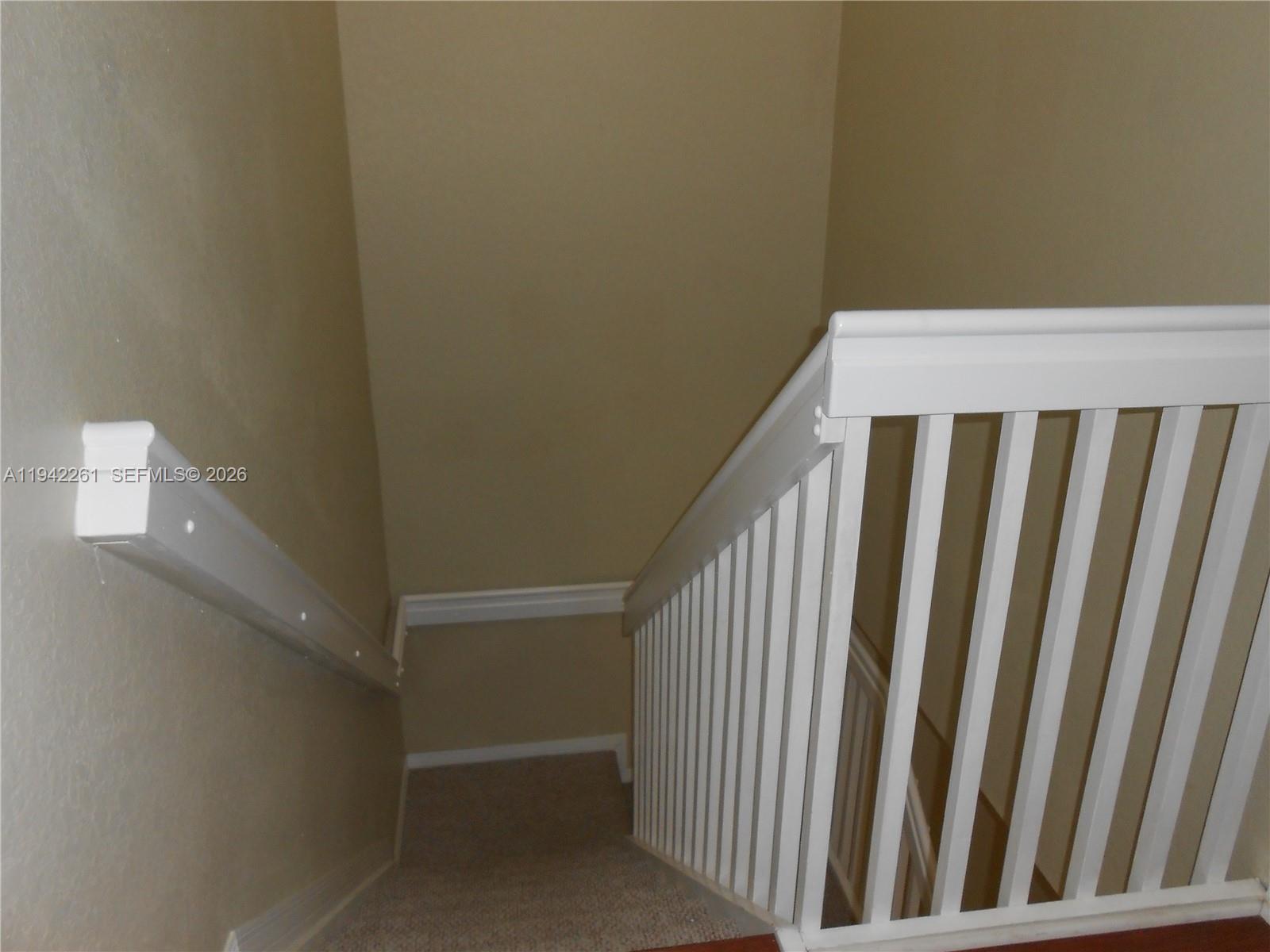 12470 Southwest 122nd Street Miami, FL 33186 - Photo 22 of 26 a view of a hallway with staircase