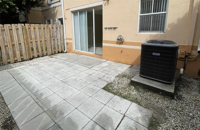 a spacious bathroom with a granite countertop bathtub and a sink