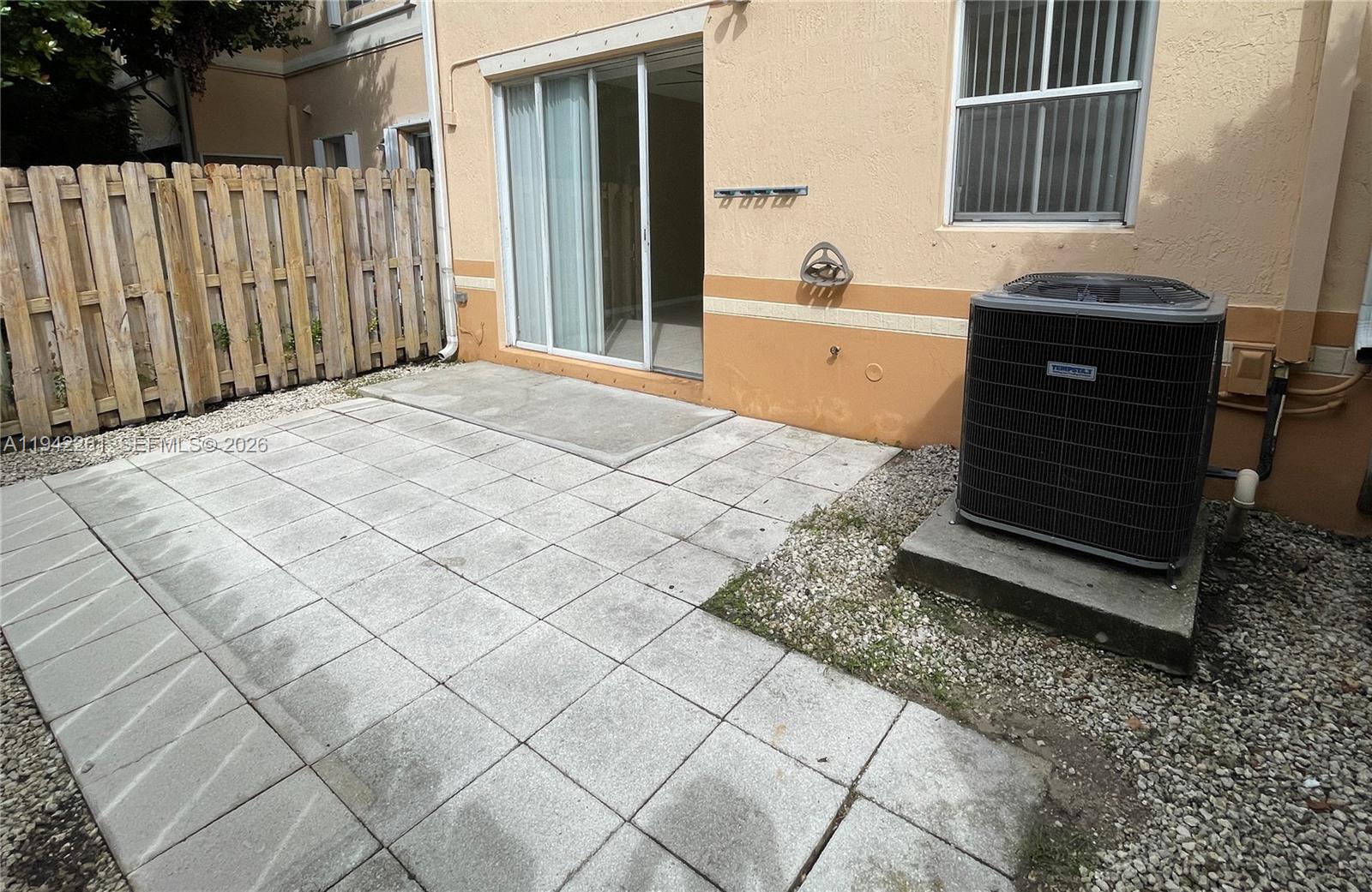 12470 Southwest 122nd Street Miami, FL 33186 - Photo 25 of 26 a spacious bathroom with a granite countertop bathtub and a sink
