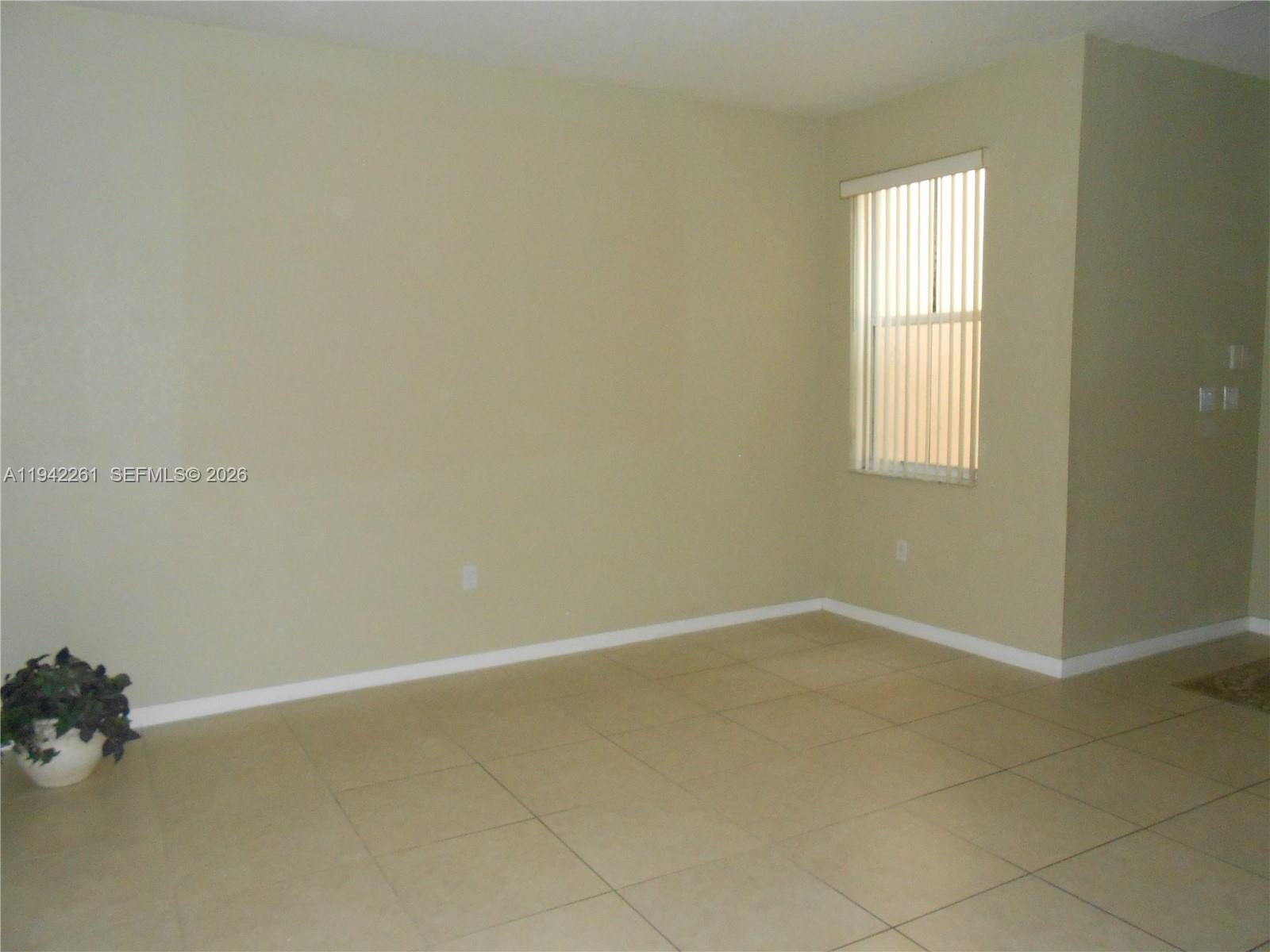 12470 Southwest 122nd Street Miami, FL 33186 - Photo 5 of 26 an empty room with a window