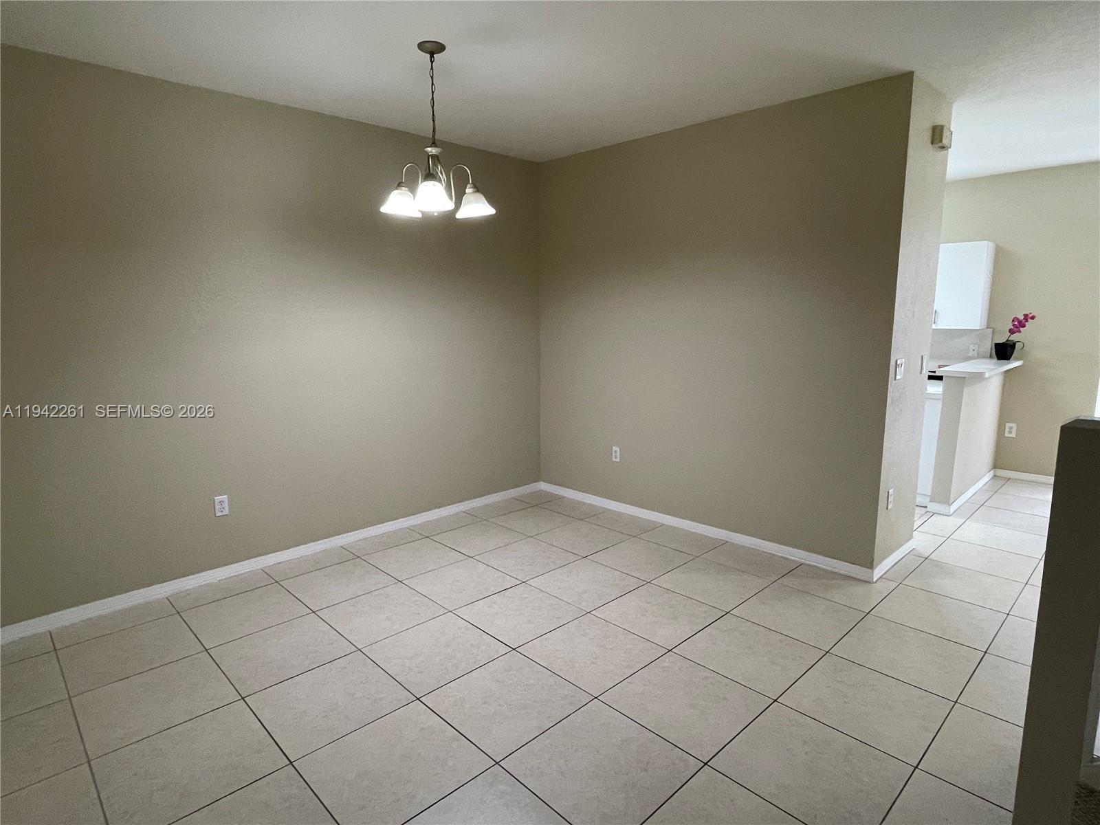 12470 Southwest 122nd Street Miami, FL 33186 - Photo 9 of 26 a view of empty room with wooden floor