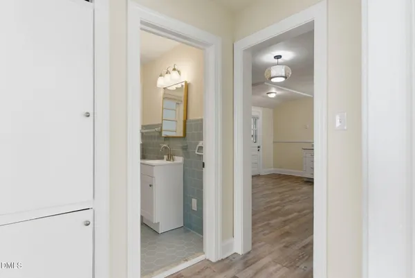 a bathroom with a glass door shower