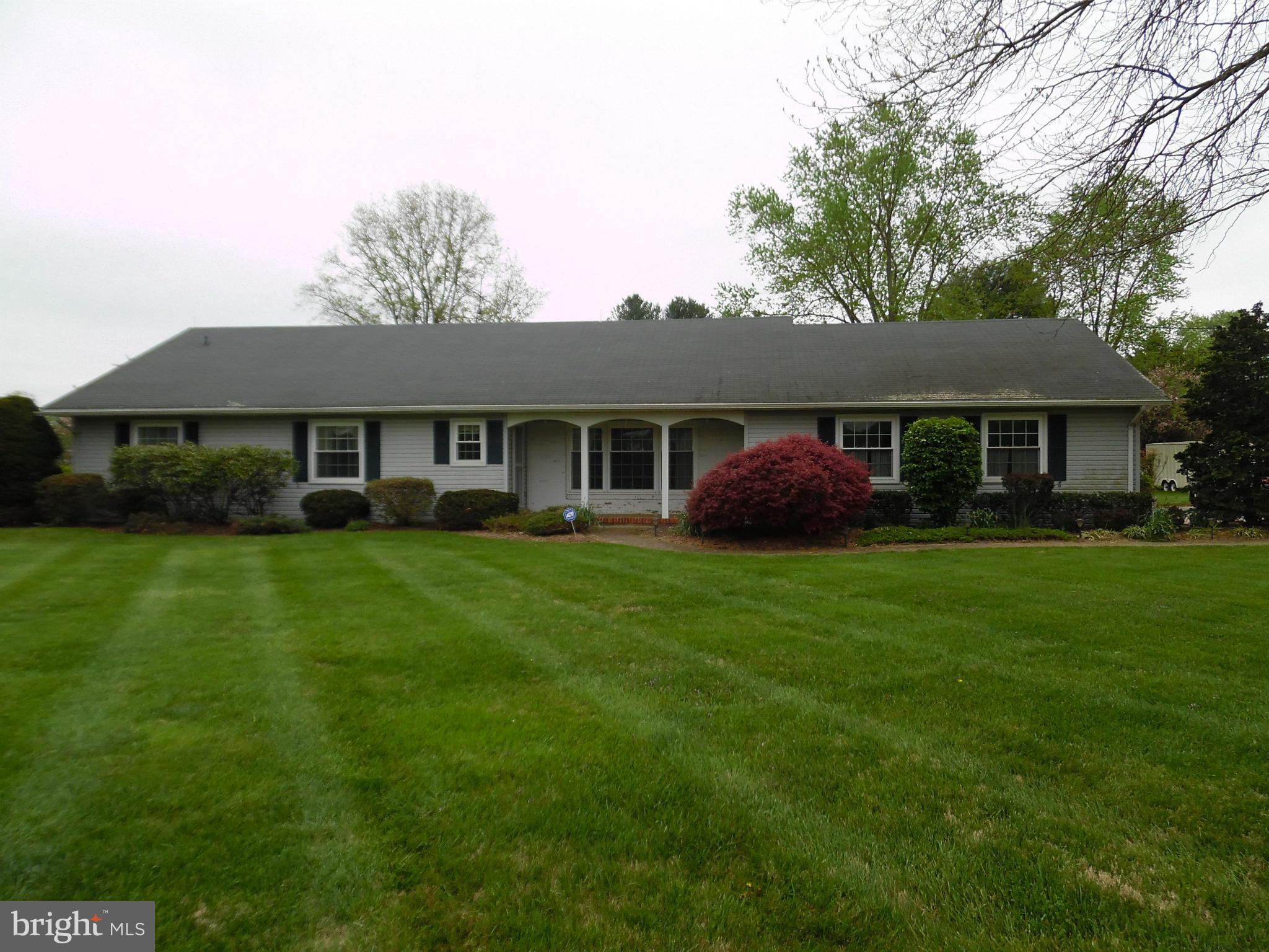 15031 Priceville Road Sparks, MD 21152 - Photo 1 of 4 a front view of a house with a garden