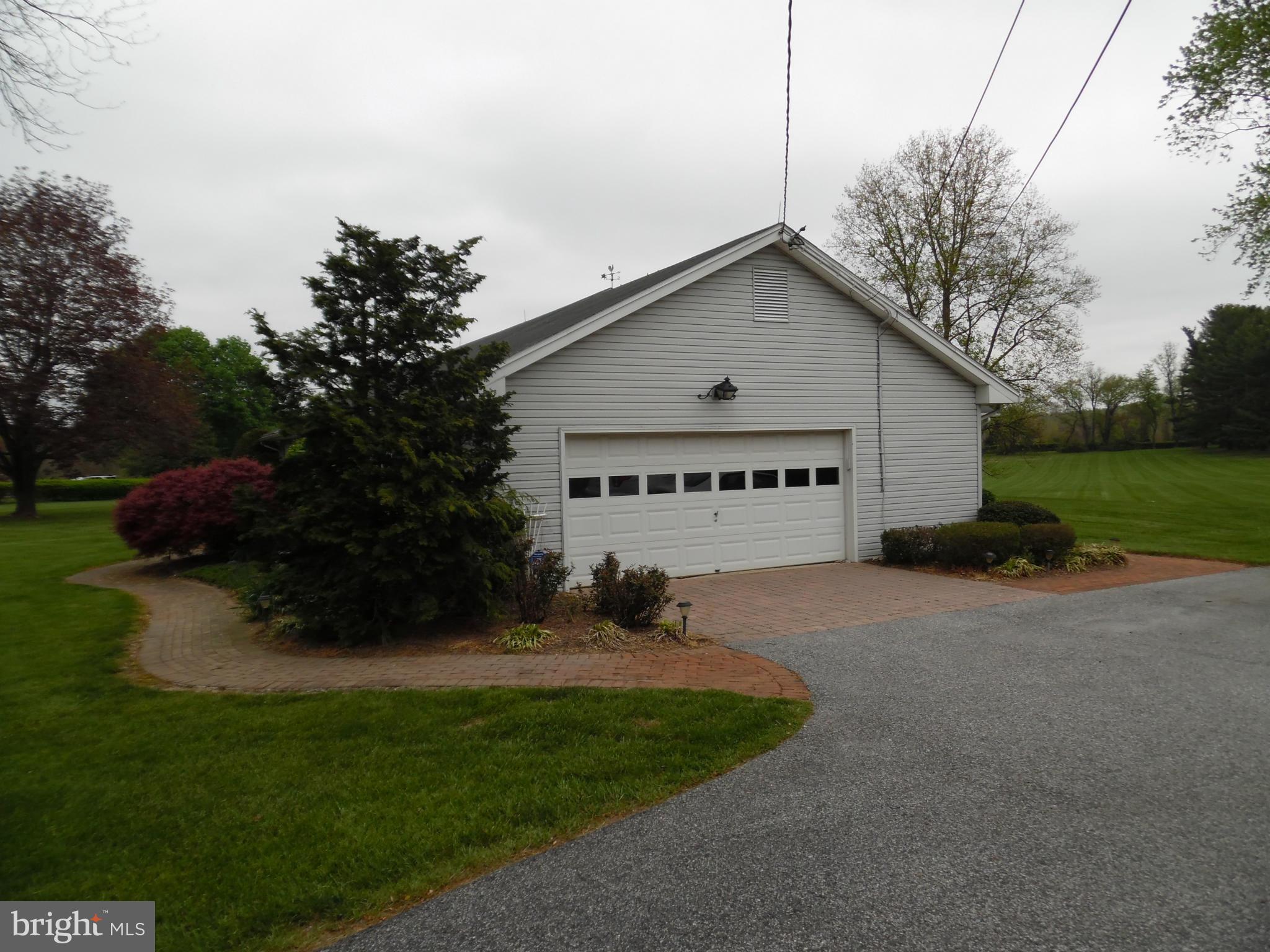 15031 Priceville Road Sparks, MD 21152 - Photo 2 of 4 a view of a house with a yard and garage