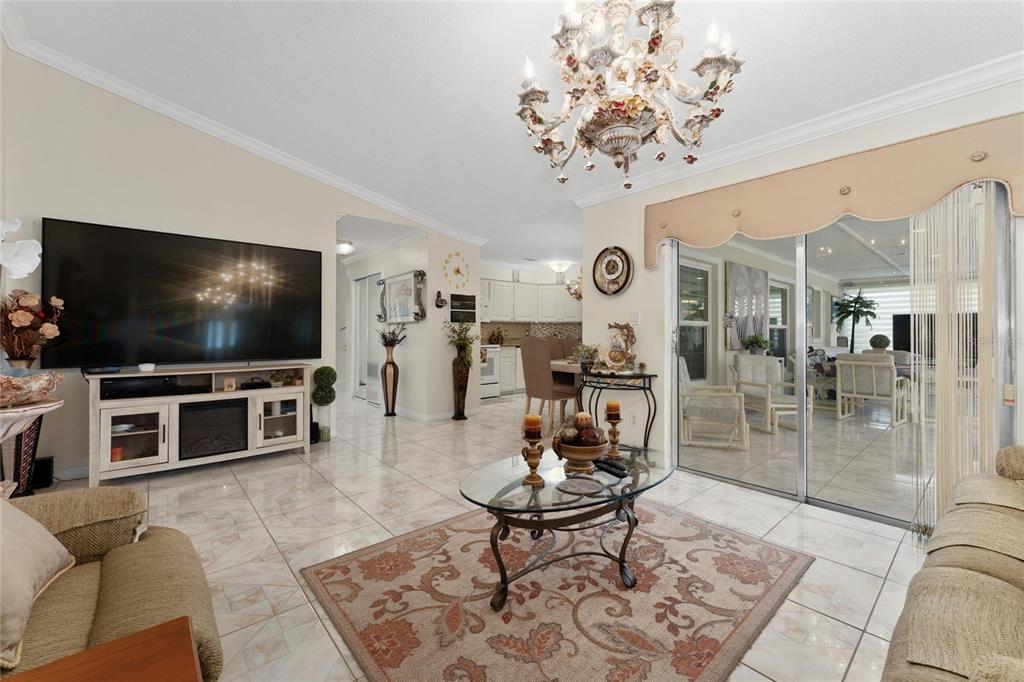 2779 Muscatello Street Orlando, FL 32837 - Photo 12 of 36 a living room with furniture and a flat screen tv