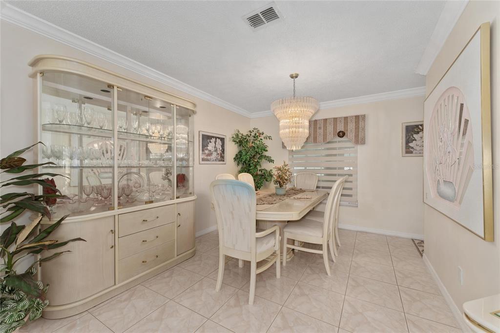 2779 Muscatello Street Orlando, FL 32837 - Photo 16 of 36 a dining room with furniture and window