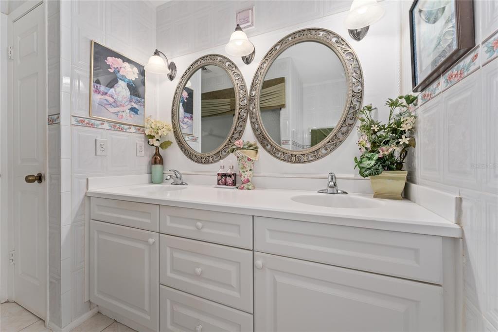 2779 Muscatello Street Orlando, FL 32837 - Photo 19 of 36 a bathroom with a sink and a mirror