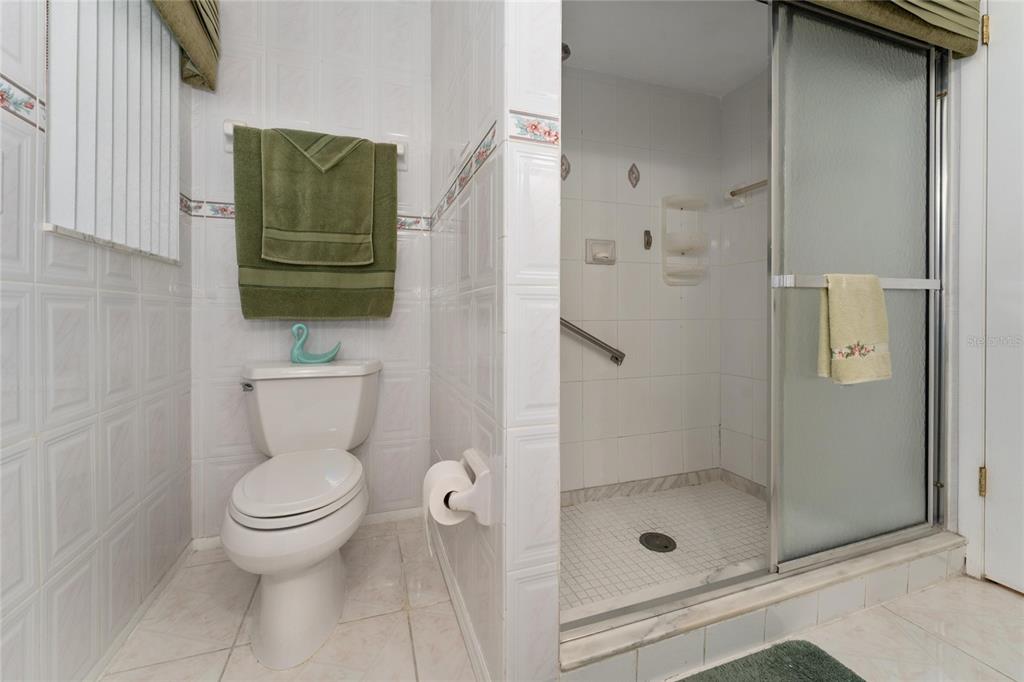 2779 Muscatello Street Orlando, FL 32837 - Photo 20 of 36 a bathroom with a toilet and a shower