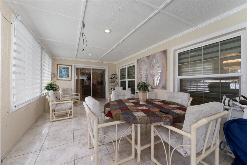 2779 Muscatello Street Orlando, FL 32837 - Photo 27 of 36 a dining room with furniture window and wooden floor